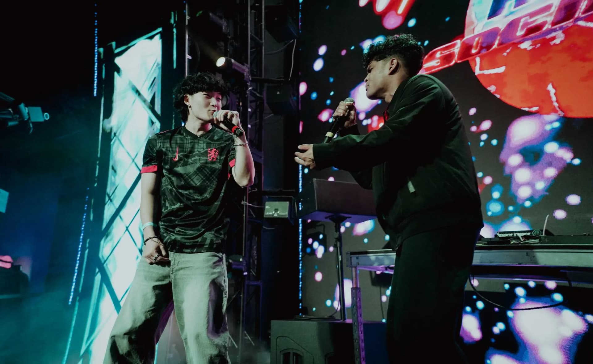 Basu and Sam Suen performing together on stage